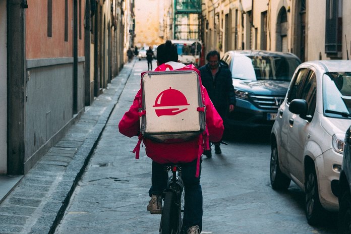 Food Delivery executive delivering orders on a bicycle