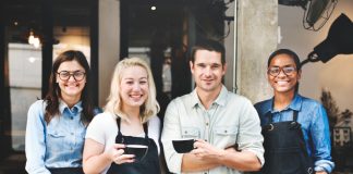 How To Keep Restaurant Staff Motivated And Happy: 10 Golden Tips Restaurant staff posing for a group photograph