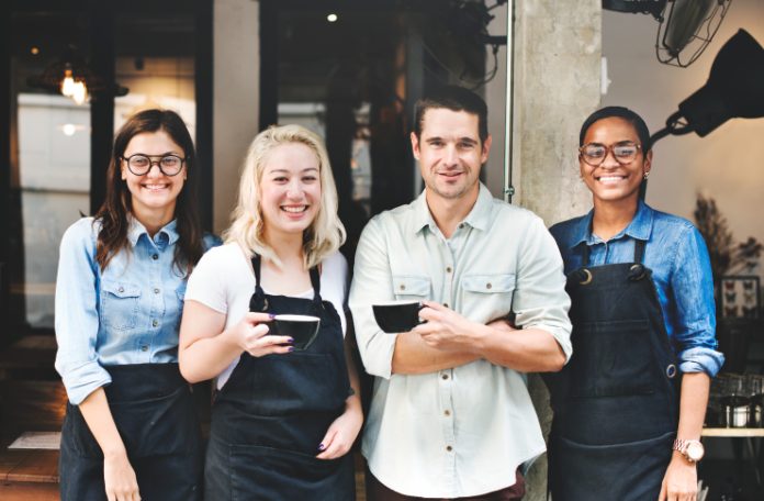 Restaurant staff posing for a group photograph