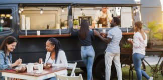 A Complete Guide On How To Open A Food Truck Business In India In 2023 Customers at a food truck ordering meals