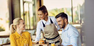 Effective Strategies To Improve Your Restaurant Service And Provide A Stellar Guest Experience – A 2023 guide Restaurant staff serving customers on table