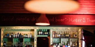 Increasing Restaurant And Bar Profits In 2023 – 9 Effective Ways You Can’t Go Wrong With! Two women sitting at a bar holding their drinks.