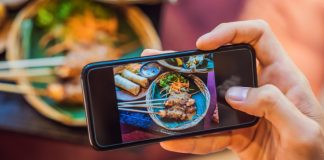 The Complete Guide To Social Media Marketing For Restaurants Restaurant customer taking a picture of food with mobile phone