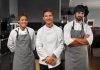 The Ultimate 2023 Guide To Restaurant Staff Management – All You Need To Know Three kitchen staff members posing for a photograph in a restaurant's Kitchen