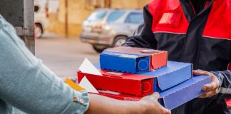 Cloud Kitchen Delivery executive delivering the order at customer's doorstep