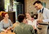 What Brings Customers Back To Your Restaurant: The Customers’ Verdict Restaurant staff taking order from customers on the table