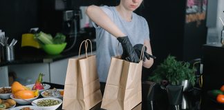 Trends Emerging In The Food Delivery And Online Ordering Post Pandemic Waitress packing Order