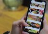 8 Key Benefits of Online Ordering System for Restaurants A person ordering food from a restaurant mobile app