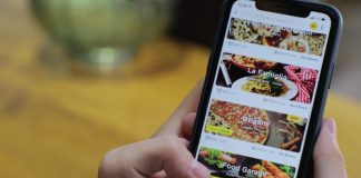 8 Key Benefits of Online Ordering System for Restaurants A person ordering food from a restaurant mobile app
