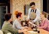 10 Intangible Factors Influencing The Customer Experience And Retention At A Restaurant Restaurant staff attending customers at a table
