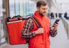 7 Challenges Faced by Food Delivery Services and How to Address Them Food Delivery Executive using mobile phone