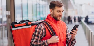 7 Challenges Faced by Food Delivery Services and How to Address Them Food Delivery Executive using mobile phone