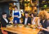 7 Proven Ways To Attract More Customers To Your Restaurant Restaurant Staff taking order from customers