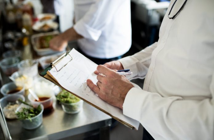 Restaurant Manager calculating the costs of recipes