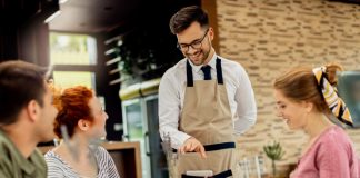 5 Restaurant Customer Service Techniques To Bring Back More Customers Restaurant staff attending the customers with a smile