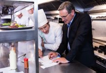7 Pro Tips To Keep Restaurant Food Costs Under Control Restaurant manager and chef calculating the food costs