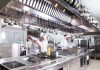 Boost the Efficiency and Layout of your Fast-Food Restaurant Kitchen by Choosing the Right Equipment A chef working in a well equipped fast food restaurant kitchen
