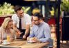 Grow your Restaurant Business By Building a Better Customer Persona Restaurant staff attending the customers at their table