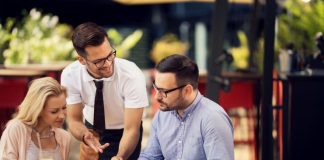 Grow your Restaurant Business By Building a Better Customer Persona Restaurant staff attending the customers at their table