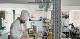 The Ultimate Guide To A Cloud Kitchen Business Chef preparing orders in a cloud kitchen restaurant