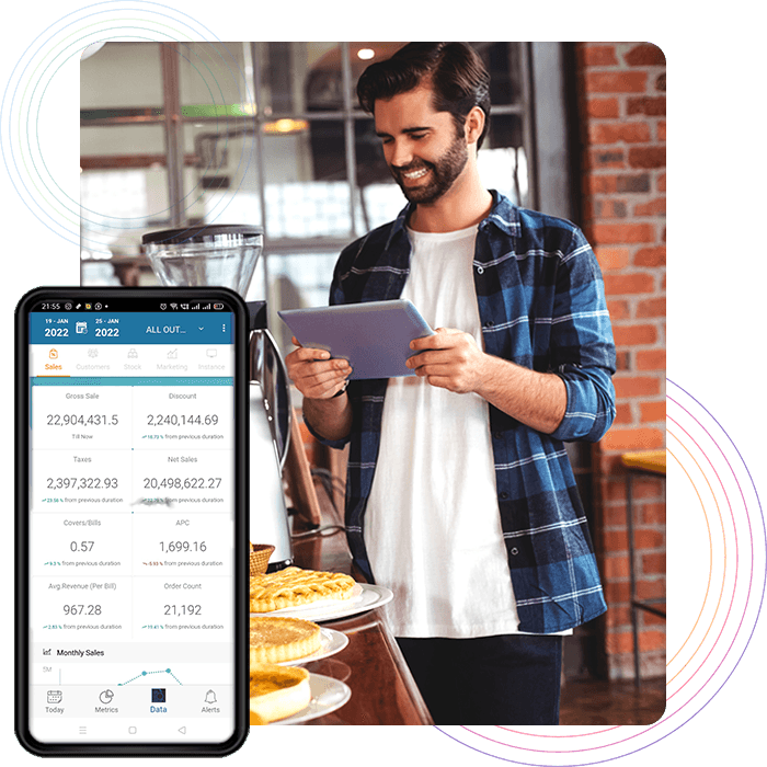 Enterprise Reporting Man checking QSR restaurant reports on a tablet