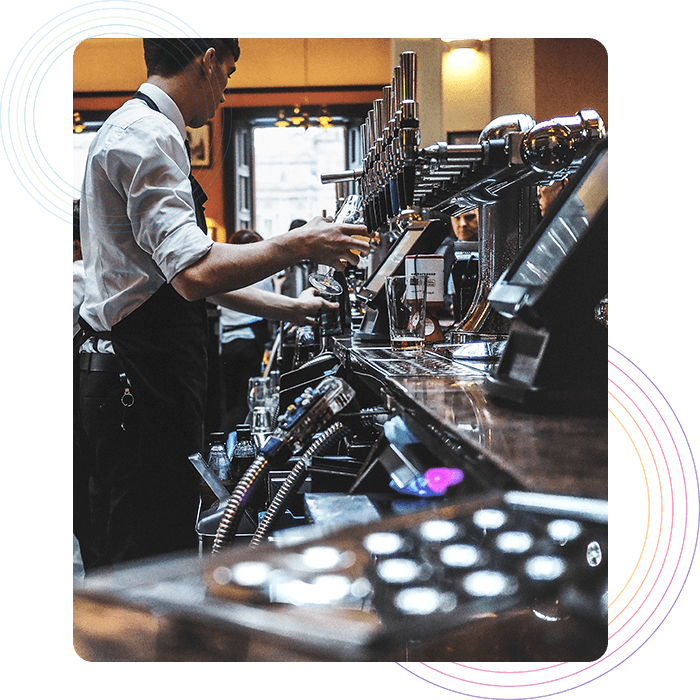 Kitchen staff preparing drinks displayed in kitchen display system