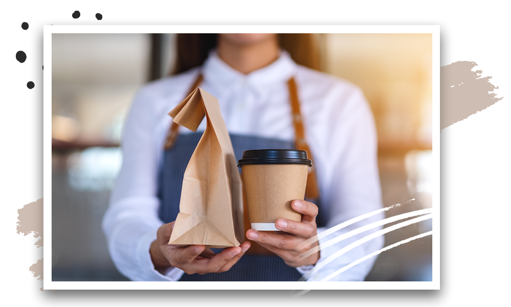 Restaurant staff holding a packed order