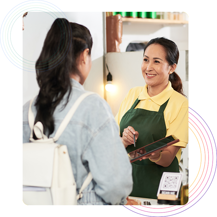 analytics-optimized-food-menu Restaurant staff taking order from a customer on a tablet