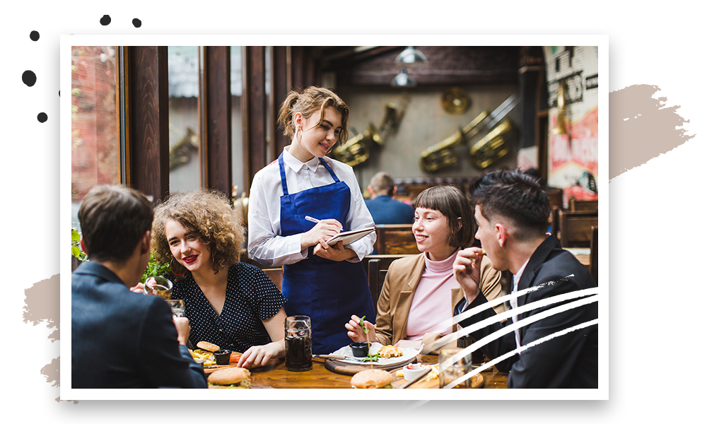 Waiter taking order from customers on table