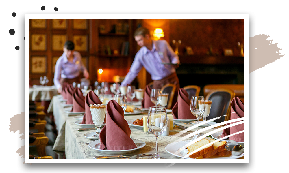 Hotel staff preparing the table for customers