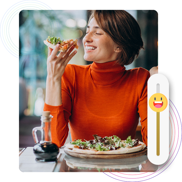 A customer enjoying her pizza in a restaurant